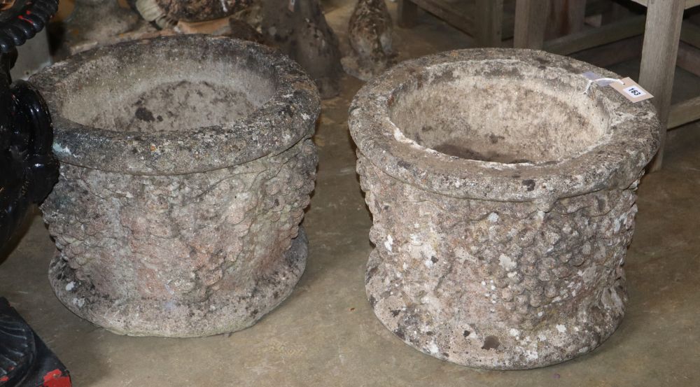 A pair of circular stone vineous planters, diameter 46cm, H.36cm